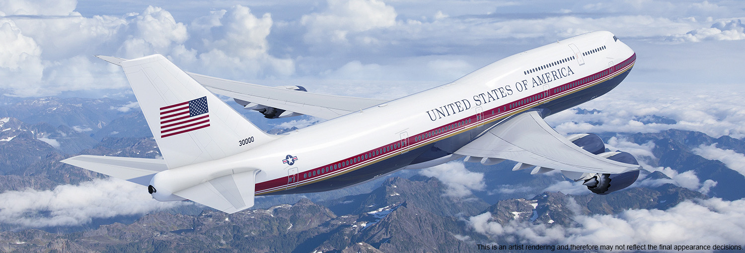Picture of Air Force One in flight over mountains.