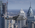 MH-139 in flight over city.