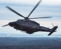MH-139 in flight over terrain.