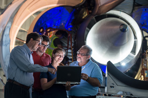 engineers looking at laptop