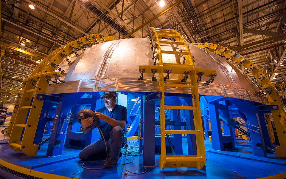 Space Launch System in factory, worker