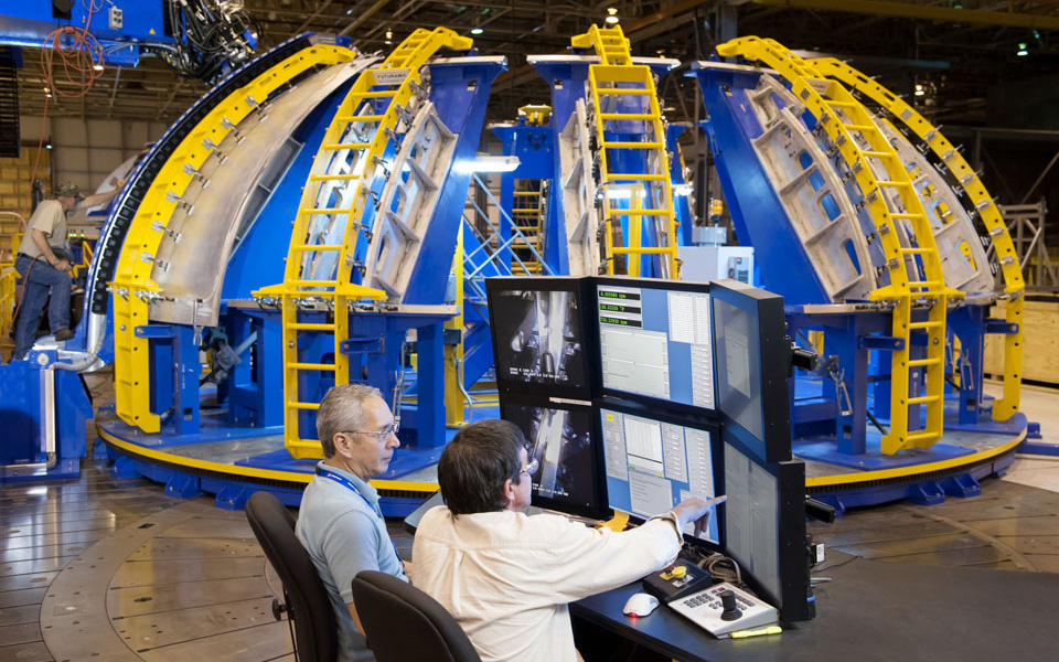 Space Launch System in factory, engineers