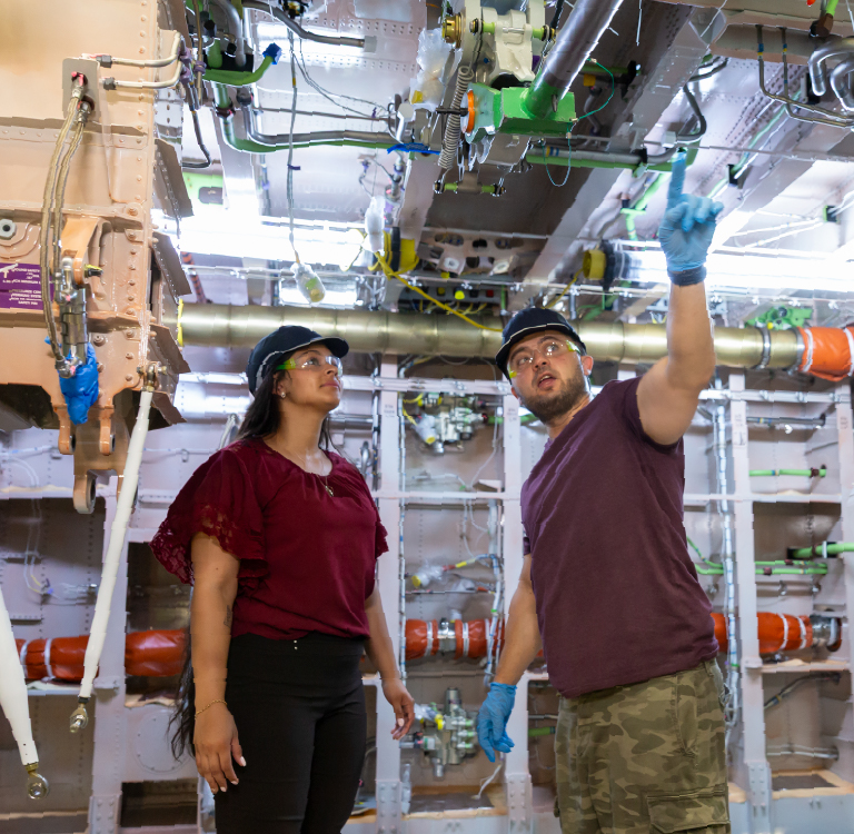 Workers in a bucket lift