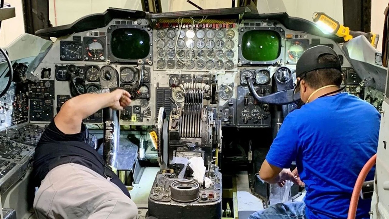 Boeing San Antonio manufacturing teammates work in the cockpit to further understand and analyze the space for airspeed probes on the B-52 “Damage Inc. II” at the Oklahoma City High Bay facility.