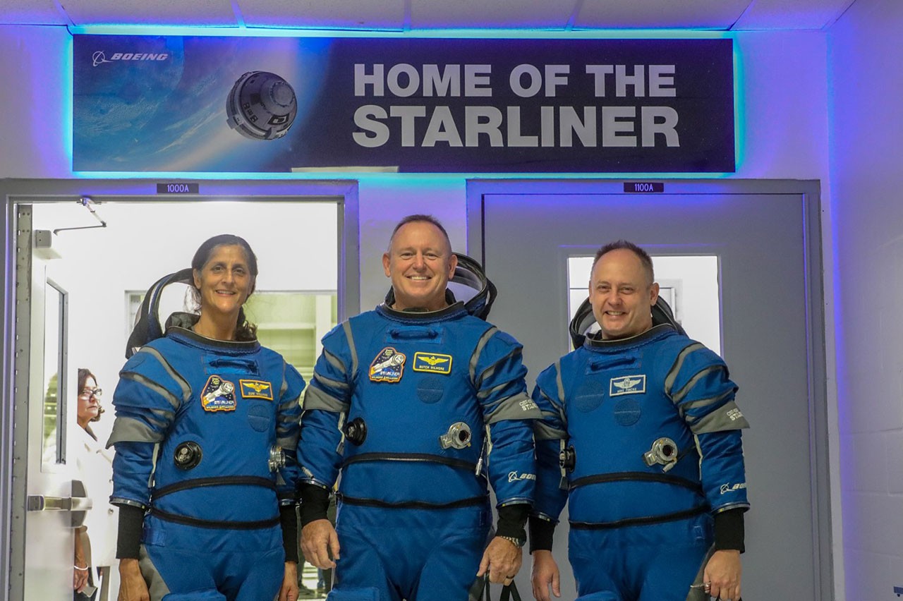 NASA astronauts Suni Williams, Butch Wilmore and Mike Fincke at the Commercial Crew and Cargo Processing Facility.