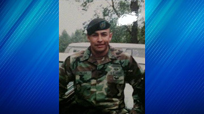A portrait of Armando Mejia in a military uniform