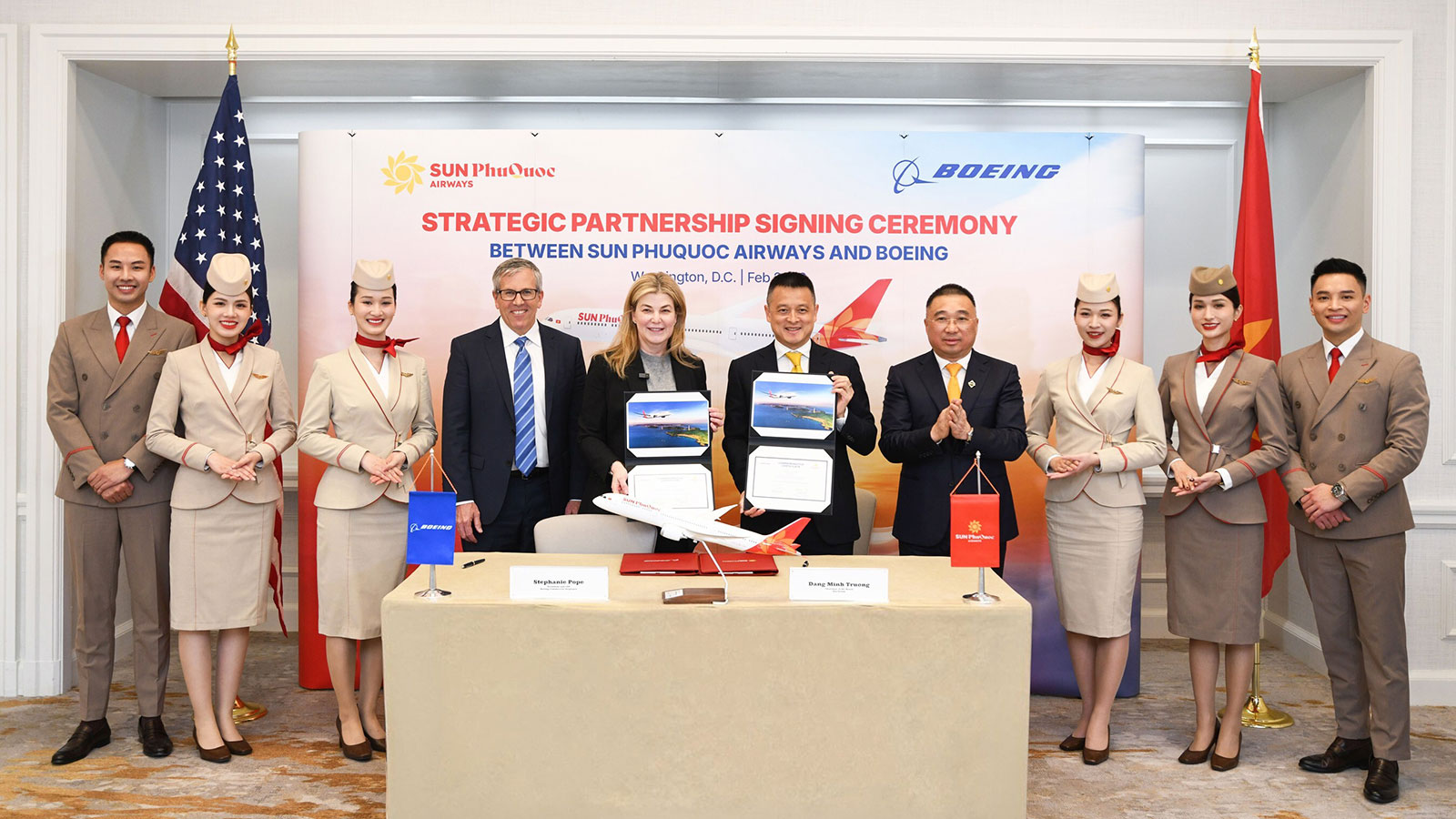 Leaders of Sun Group and Sun PhuQuoc Airways joined Boeing at a ceremony in Washington, D.C. today to announce an order for up to 40 787 Dreamliner jets, which will serve as the backbone of the airline's widebody fleet. Flanked by cabin crew members are (left to right): Brad McMullen, Boeing senior vice president of Commercial Sales and Marketing; Stephanie Pope, president and CEO of Boeing Commercial Airplanes; Dang Minh Truong, chairman of Sun Group; and Tran Minh Son, deputy chairman of Sun Group.
