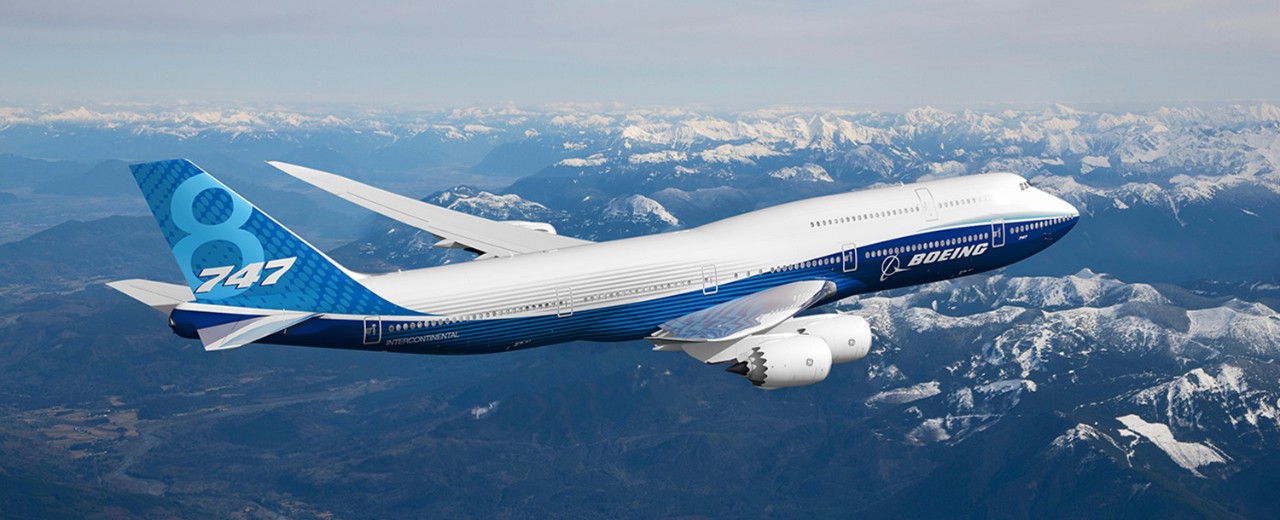 747-8 in flight over mountains