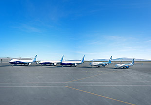 Group of Boeing Freighters lined up on a tarmac 