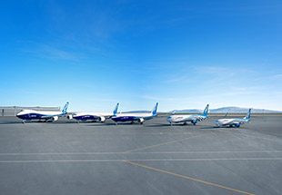 A lineup of Boeing freighters, parked on the tarmac, in a well-organized formation.