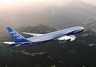 777 in flight over mountains