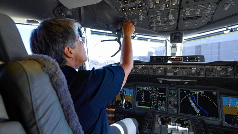 Capt. Ross in the flight deck of the first 777-9 flight test airplane.