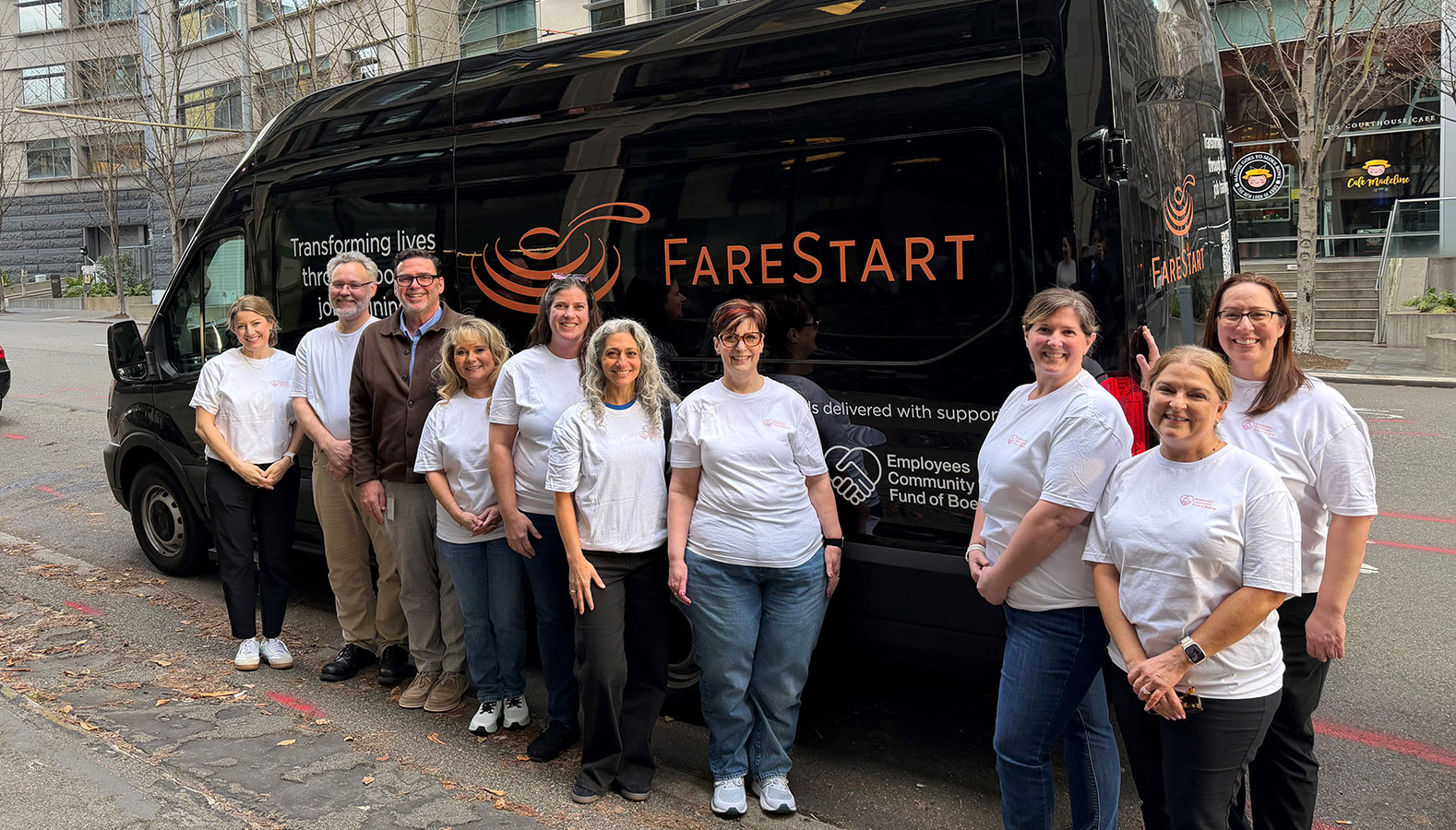 Employees Community Fund of Boeing representatives join FareStart CEO Patrick D'Amelio in front of the newly branded FareStart delivery van. 