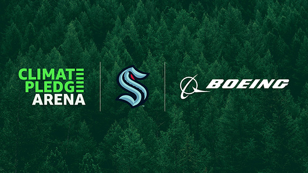 Climate Pledge, Kraken, Boeing logos over trees.