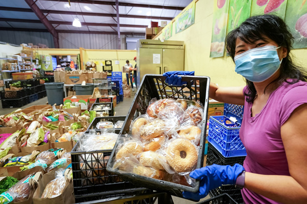 Ballard Food back volunteer prepares food for the community.