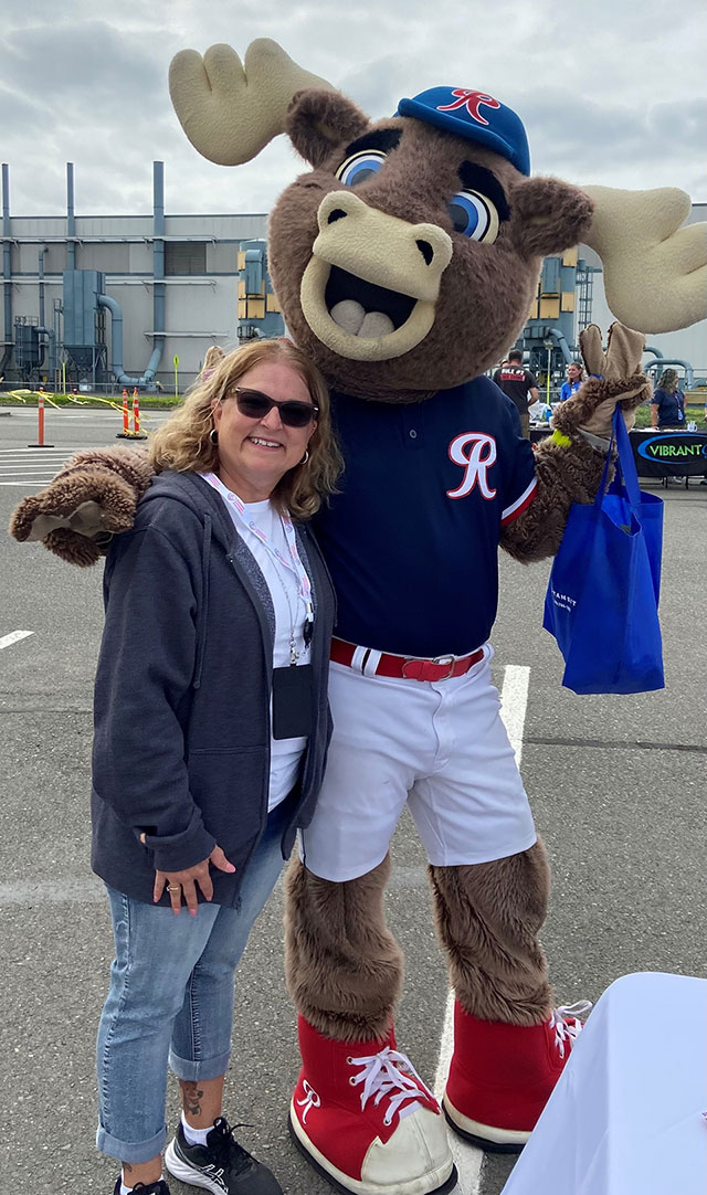 Katrina White stands with the Tacoma Rainiers’ mascot, Rhubarb, while promoting the ECF Puget Sound Chapter at the Frederickson Community Fair.