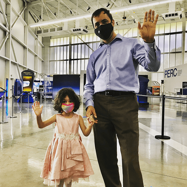   A budding aviation enthusiast and her father viewing the exhibits.