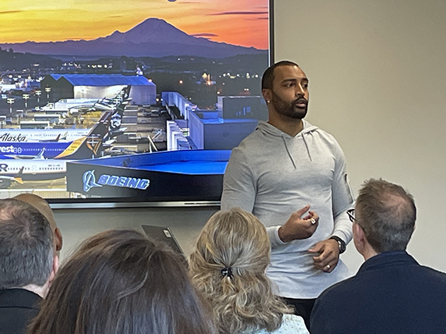 Doug Baldwin talks with community leaders about his dream of starting a community center in Renton; a dream that is now a reality. Boeing photo