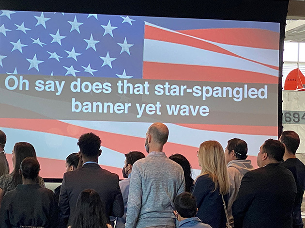 New citizens sing the Star Spangled Banner.