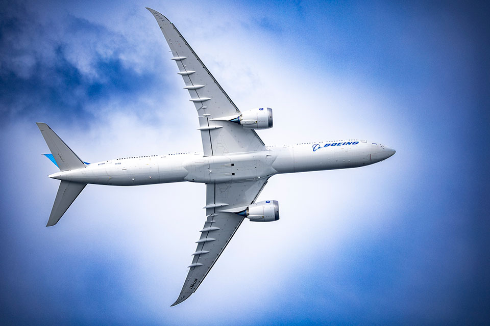 A 777-9 performs during the air show at the Seafair Festival in Seattle. This is a flight demonstration at an area designated for an air show.