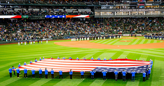 Members of the Boeing Veterans Engagement Team hold the U.S. flag.