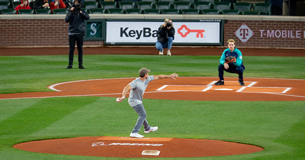 Nate Boyer of Merging Vets and Players throws out the first pitch at a Mariners game.