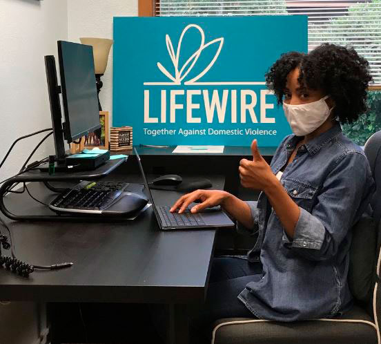 Woman sitting in front of a computer at Lifewire office.