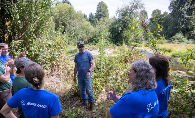 Volunteers at the Lake Sammamish State Park event gather to talk.
