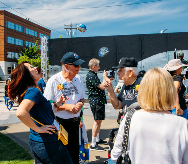   Boeing alum Charles Martin (right) jokes that fellow Boeing alum Dennis McKillip (left) is the reason his fingerprints never made it to the moon. (City of Kent photo)