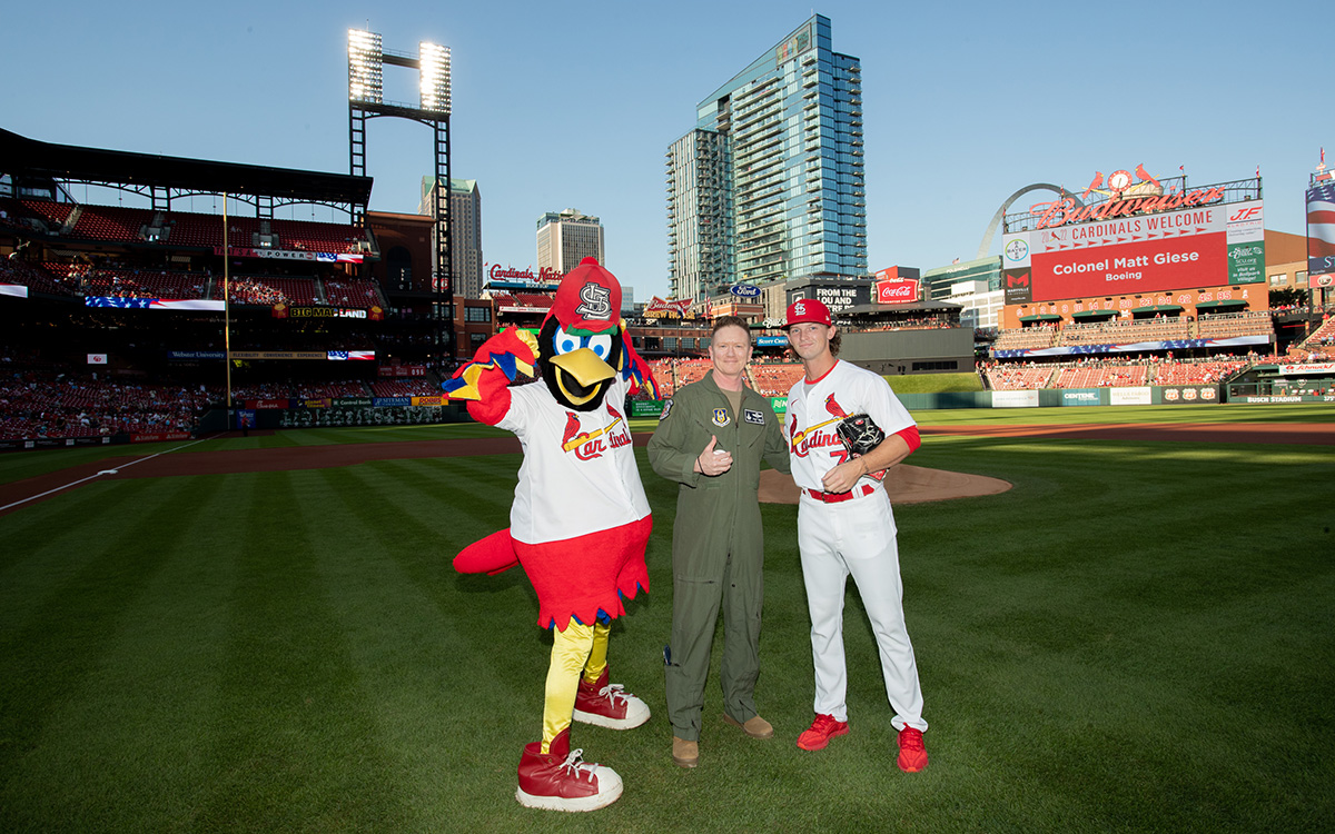 Colonel Matt Giese throws out the first pitch at a St. Louis Cardinals game during the Boeing Military Salute.
