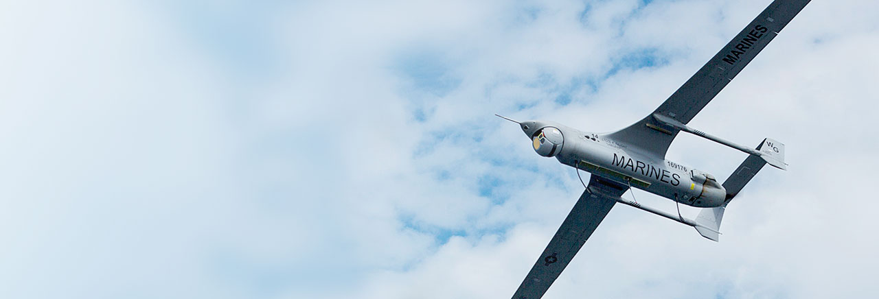 rq21a blackjack flying in high clouds in the background photo take from below