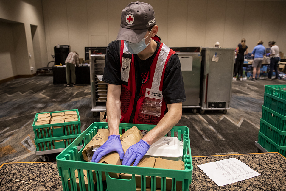 American Red Cross volunteer Kalen Pippins, helps to get meals ready