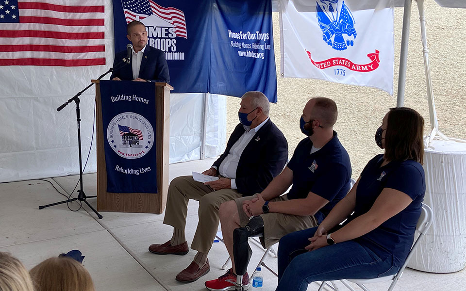 Sgt. Nathan Shumaker (second from right) during key ceremony for his new home