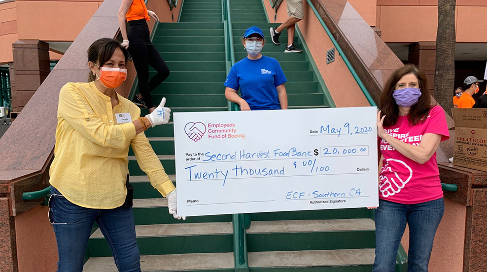 ECF rep presents large check to Second Harvest Food Bank