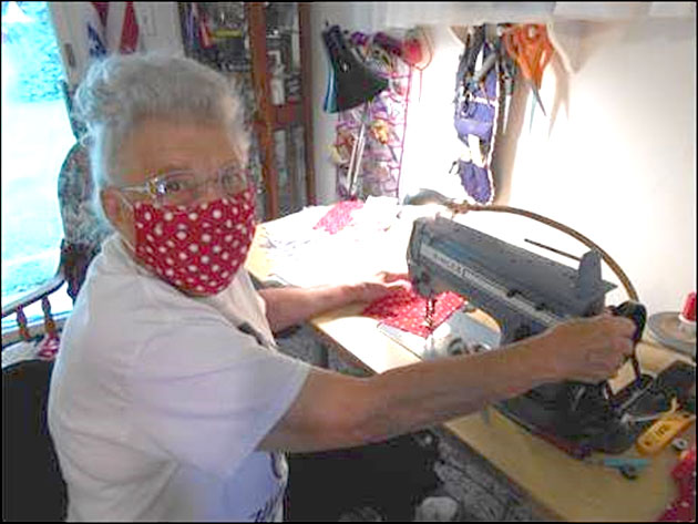 Mae Krier sews a Rosie the Riveter-themed COVID-19 mask