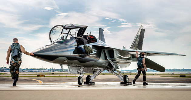   A T-7 aircrew performs a walk-around inspection of the advanced trainer before another flight. The digitally designed, built, and tested aircraft recently recorded its 400th flight as part of its rigorous engineering, manufacturing and development flight test program