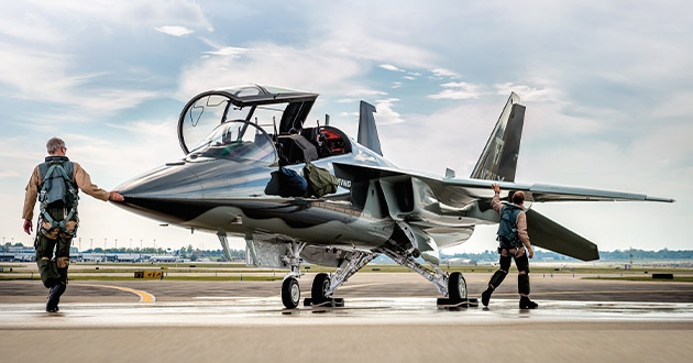 A T-7 aircrew performs a walk-around inspection of the advanced trainer before another flight. The digitally designed, built, and tested aircraft recently recorded its 400th flight as part of its rigorous engineering, manufacturing and development flight test program