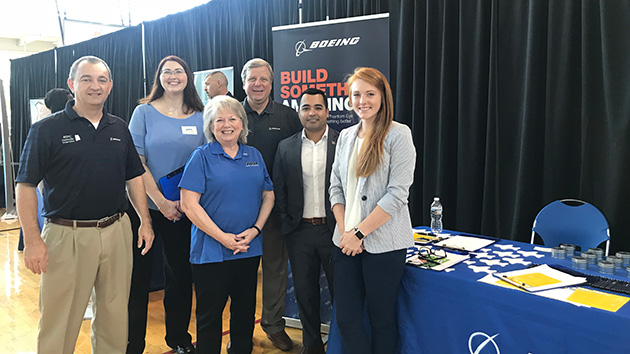 As a Boeing liaison to his alma mater, the University of Alabama in Huntsville, Campos (second from right) attends career fairs.