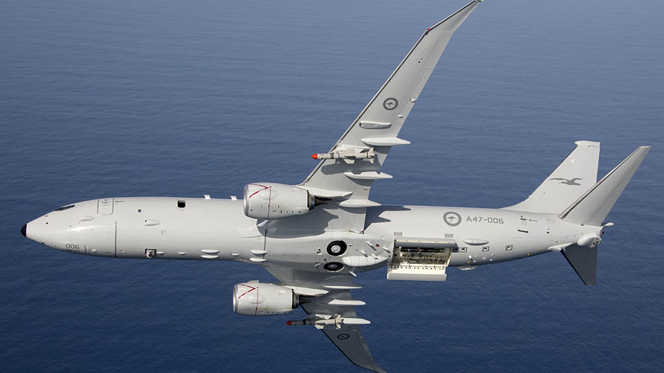Air to Air photo of Royal Australian Air Force P-8A Poseidon with Harpoon Missiles.