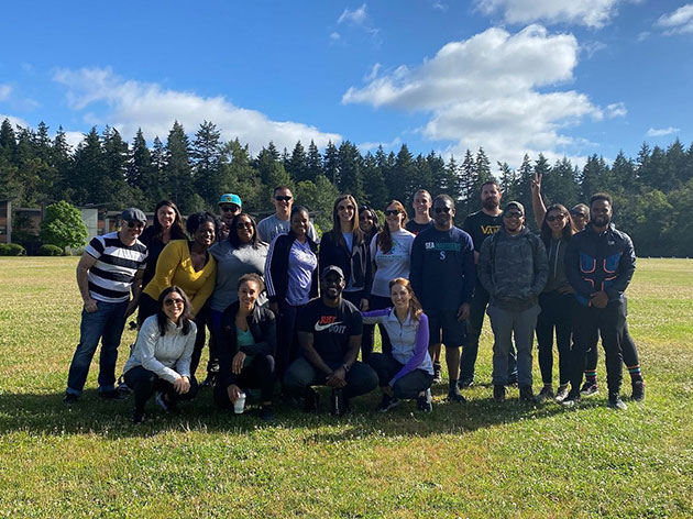 Karriema Calhoun, pictured in the gold shirt, and members of the Boeing Leadership Rotation Program meet in the Seattle area for a development opportunity in 2022. (Photo courtesy of Karriema Calhoun)