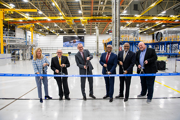   Boeing and NASA leaders cut the ceremonial ribbon