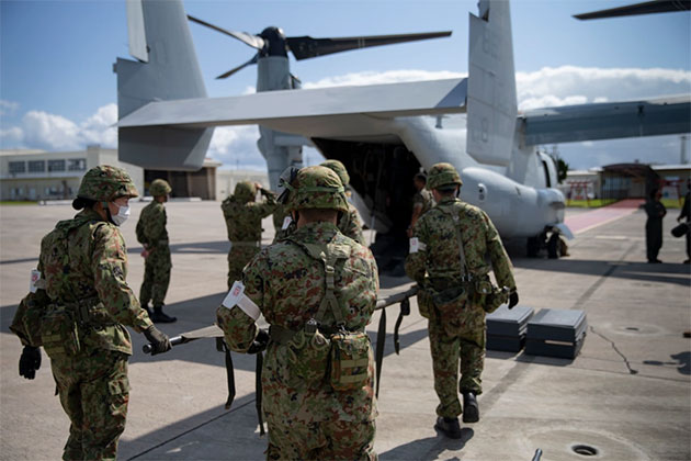 Japan Ground Self Defense Force perform simulated medical evacuation utilizing an MV-22B Osprey during Keen Sword 21 exercise at Marine Corps Air Station Futenma in Okinawa, Japan