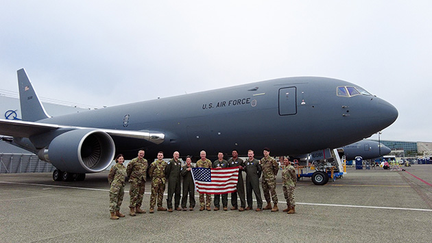 Crews from the 60th and 349th Air Mobility Wings pose in front of Travis Air Force Base’s first KC-46A at Boeing Field in Seattle, Washington.