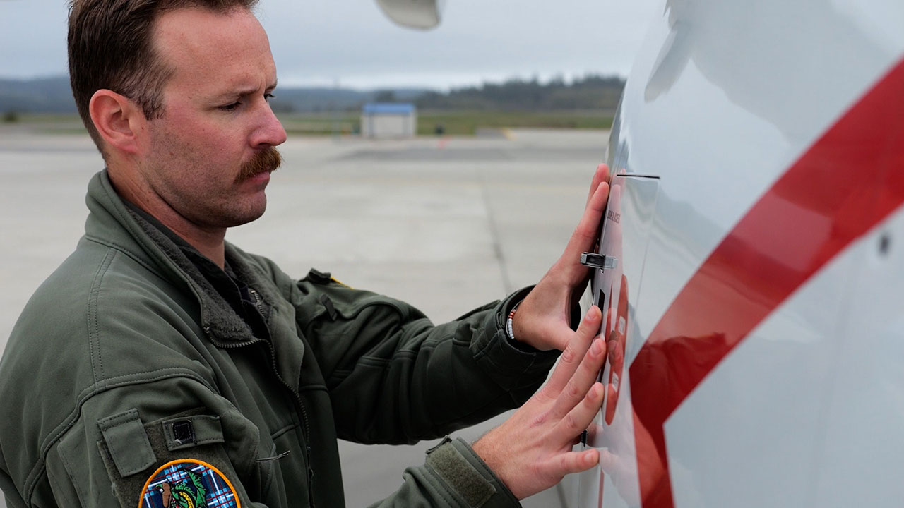 Lt. Stephen Sauter, a P-8 Aircraft Commander for Patrol Squadron FOUR (VP-4), performs an aircraft inspection.
