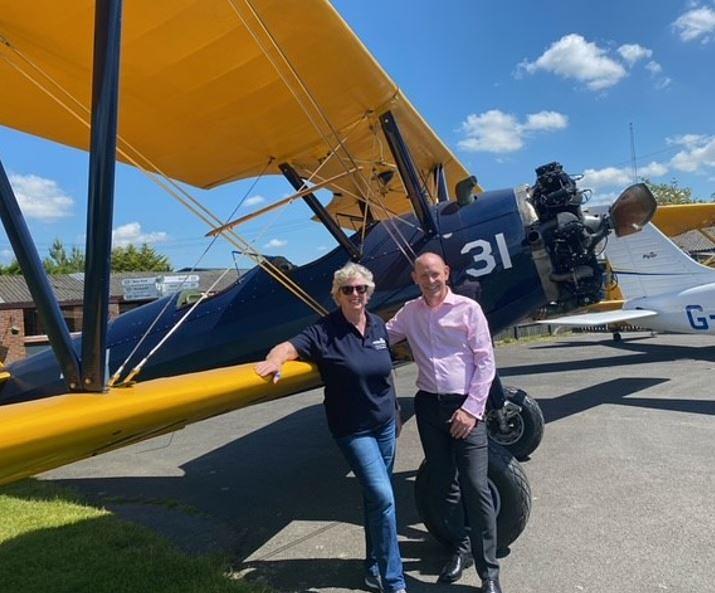 Stuart stands with Al Stocker, director of International Business Development UK, Boeing Defence UK, after  completing her FSDP flying course.