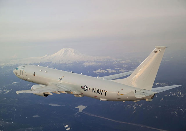 2009: The Boeing P-8A Poseidon, a maritime patrol and reconnaissance aircraft and a derivative of the 737 Next Generation, does a flyby of our old friend on a test flight.