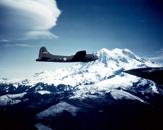 1941: With as many as 15 B-17s rolling off the assembly line per day at Seattle’s venerable “Plant 2” during World War II, the Rainier tradition continued with this E model flyby. In all, Boeing produced nearly 7,000 B-17s in Seattle during the war.