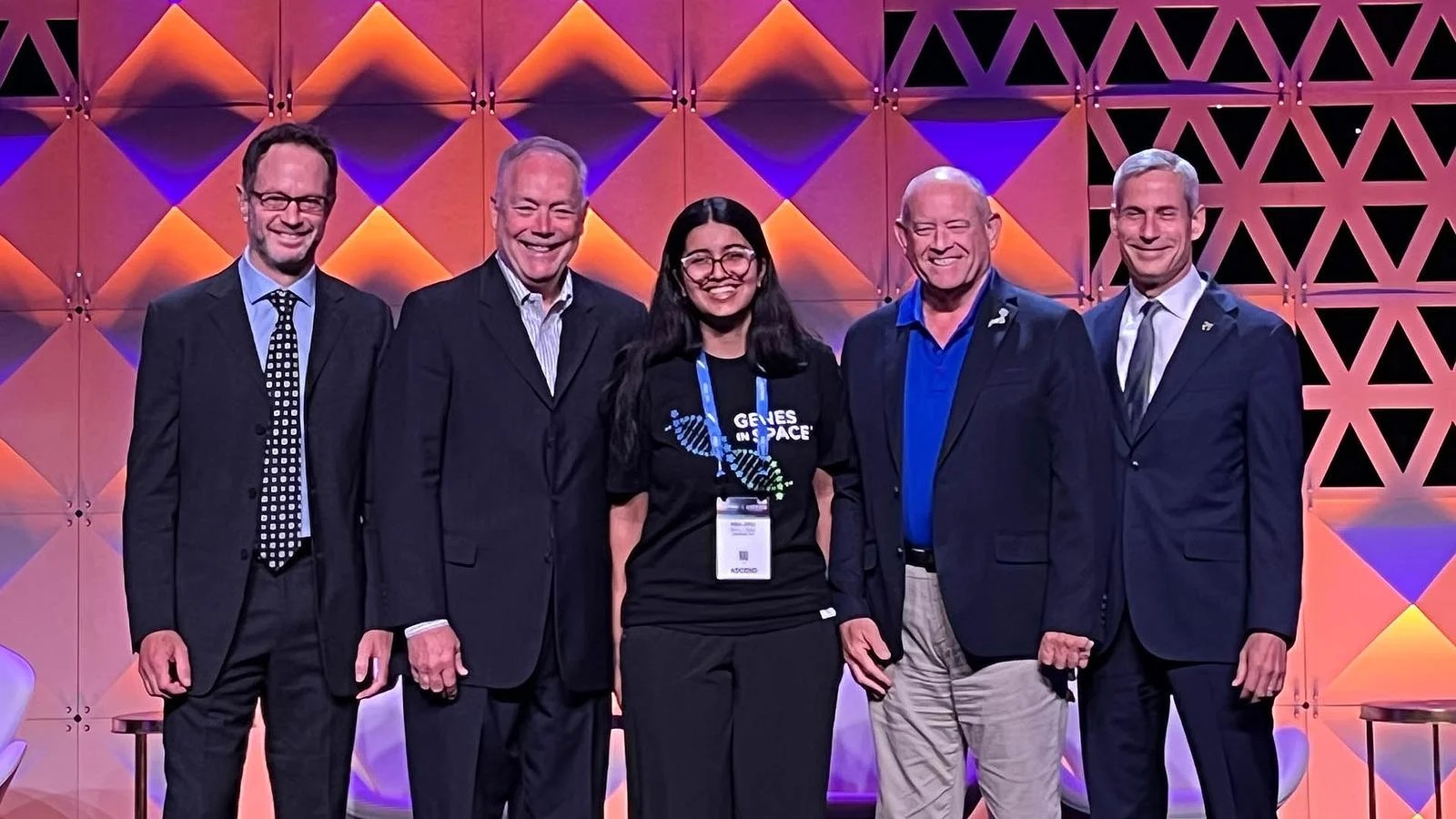  Nitya Johar (center) with Genes in Space co-founders Sebastian Kraves of miniPCR bio, Kevin Foley of Boeing, Scott Copeland of Boeing and AIAA Senior Vice President Keoki Jackson.