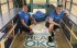 Chris Silvano (right) and Oklahoma City teammates pack books onto buses with Boeing partner ReadOKC. The Book Buses visit Oklahoma City Public Schools, allowing students to select a book of their choice to add to their home library.