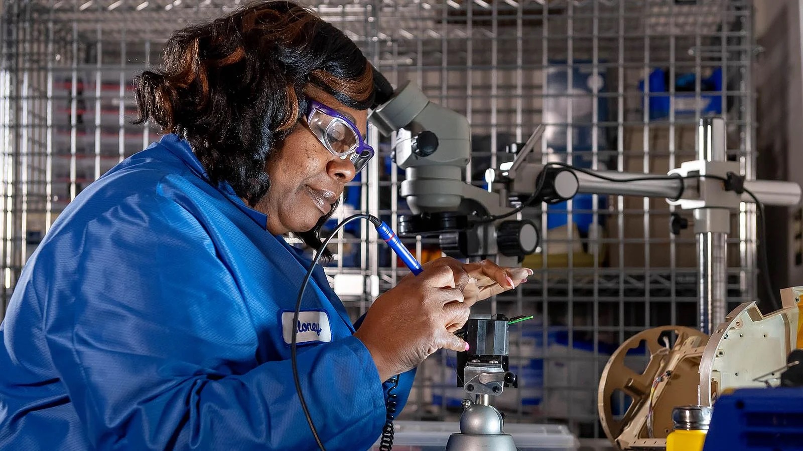 Eloney Lewis demonstrates the soldering process on Boeing’s Patriot Advanced Capability-3 (PAC-3) seeker